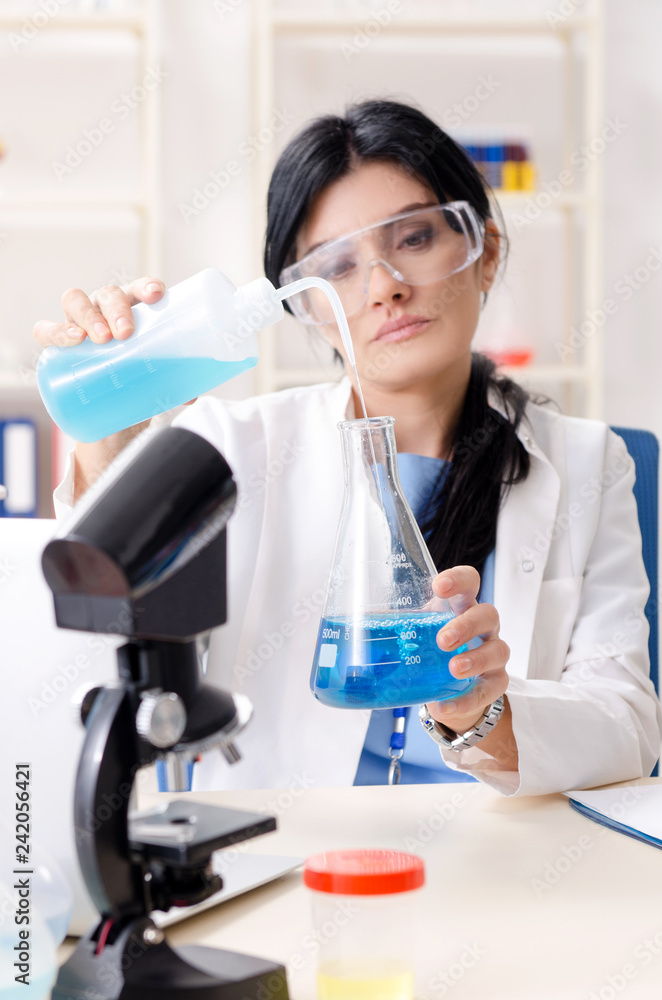 Female chemist working at the lab Female chemist working at the lab