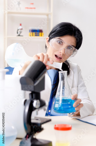 Female chemist working at the lab 