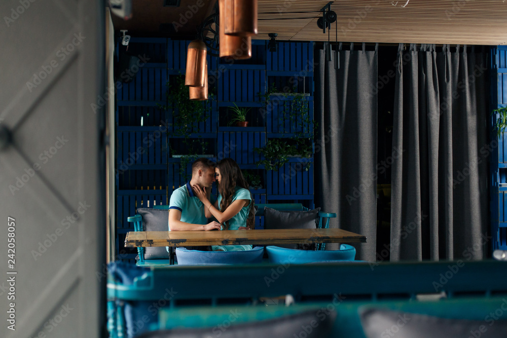 boyfriend and girlfriend enjoy each other indoor. Happy couple drinking coffee.love story concept.Couple in love looking at each other and smiling.Time for a coffee for loving couple boyfriend and girlfriend enjoy each other indoor. Happy couple drinking coffee.love story concept.Couple in love looking at each other and smiling.Time for a coffee for loving couple