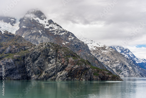 Johns Hopkins Glacier and mountains on a cloudy day in Glacier Bay, Alaska © ricjacynophoto.com