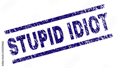 STUPID IDIOT seal print with distress style. Blue vector rubber print of STUPID IDIOT text with dust texture. Text caption is placed between parallel lines.