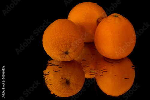 Three Oranges with reflection