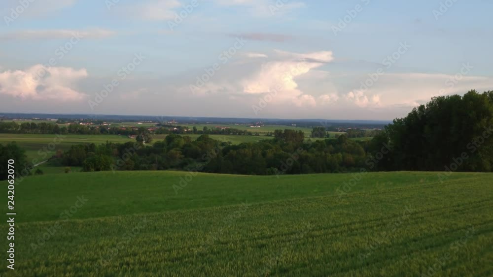 Aerial of a landscape in the sunset with villages and field in the foreground and trees in bavaria germany Aerial of a landscape in the sunset with villages and field in the foreground and trees in bavaria germany