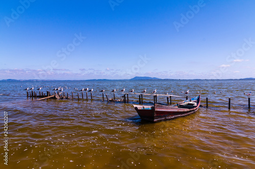 Wallpaper Mural old fishing boat on the beach Torontodigital.ca