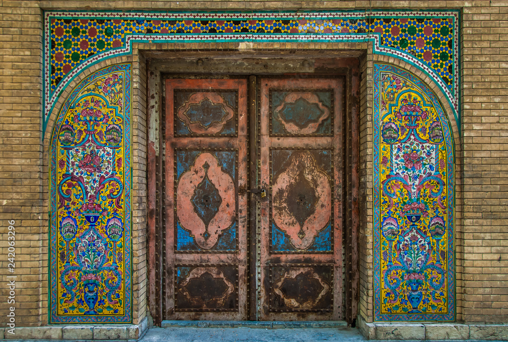 Mosaic traditional floral wall and old door