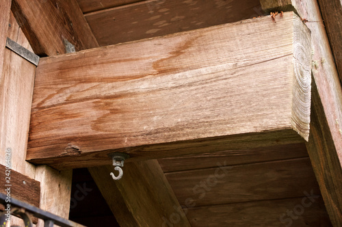 Quadro su tela Looking up at outdoor wooden roof rafter with hook and copy space and room for slogan