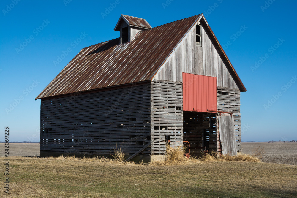 Old wooden barn in the rural open farmland. Illinois, USA Old wooden barn in the rural open farmland. Illinois, USA