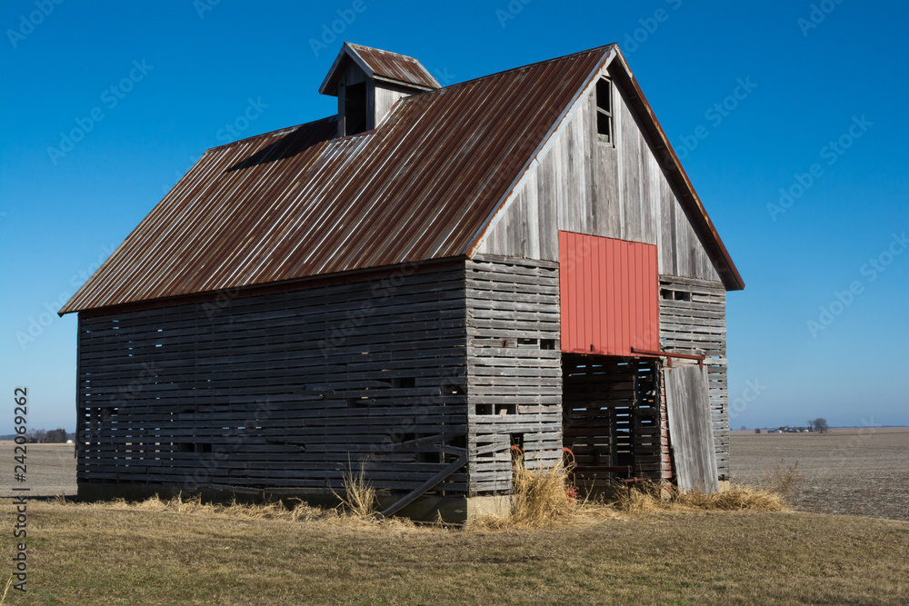 Old wooden barn in the rural open farmland. Illinois, USA Old wooden barn in the rural open farmland. Illinois, USA