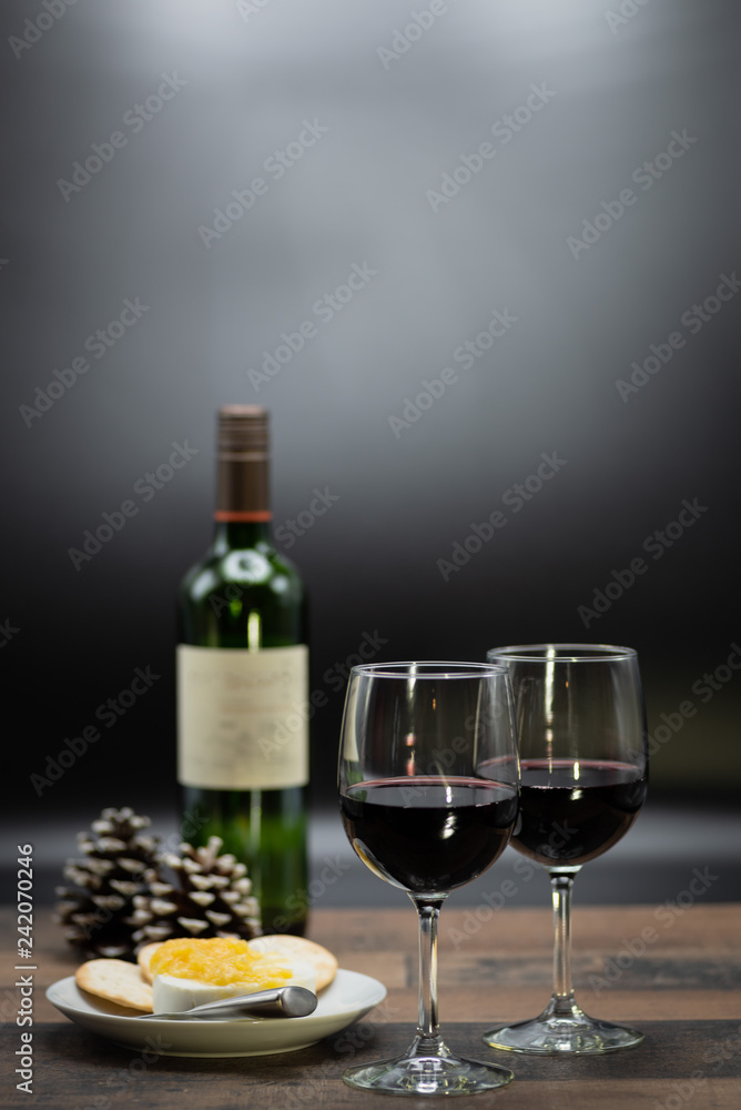 wine and cheese on wood table