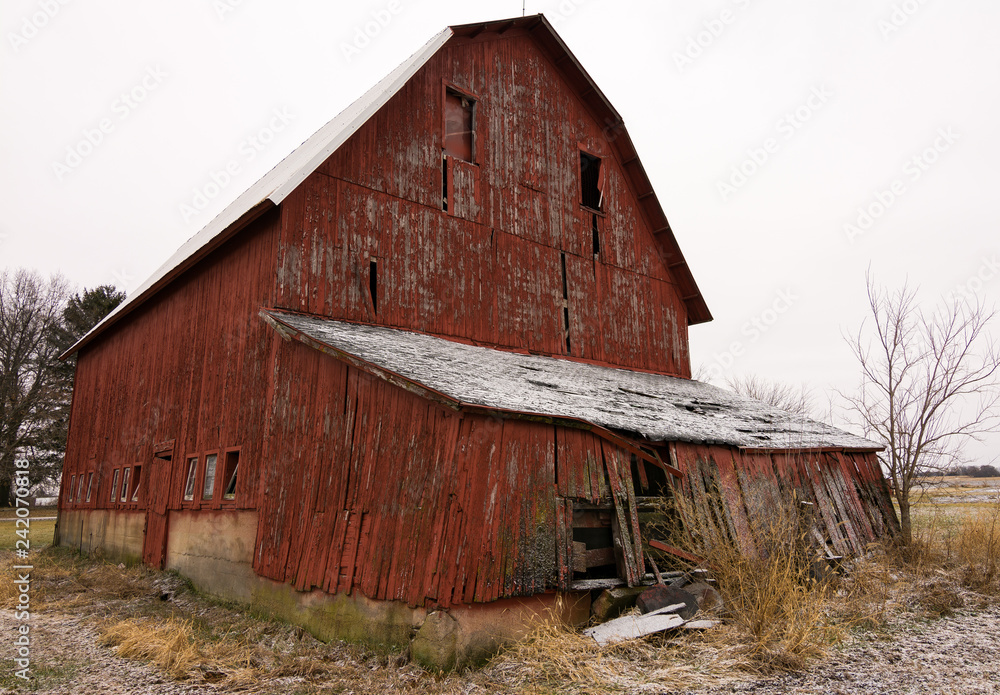 Old red barn in the rural countryside after a morning snow dusting. Norway, Illinois, USA Old red barn in the rural countryside after a morning snow dusting. Norway, Illinois, USA