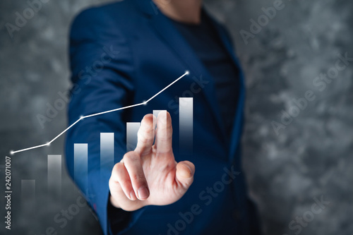 businessman touching graph