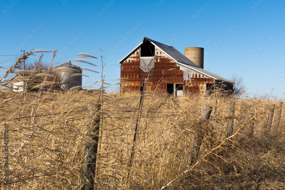 Old rustic barn in the rural Midwest on a windy Winter's day. Marshall County, Illinois, USA Old rustic barn in the rural Midwest on a windy Winter's day. Marshall County, Illinois, USA