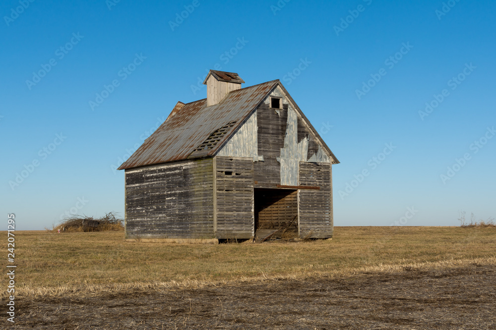 Old wooden barns in the open farmland. LaSalle County, Illinois, USA Old wooden barns in the open farmland. LaSalle County, Illinois, USA