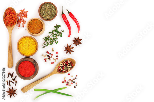 mix of spices in wooden spoon isolated on a white background with copy space for your text. Top view. Flat lay. Set or collection