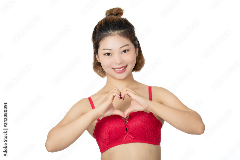 Foto de Chinese woman posing in panties and bra on white background do  Stock