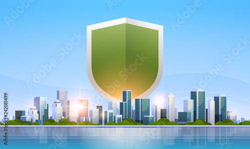 shield icon data privacy protection and security concept over big modern city building skyscraper cityscape skyline flat horizontal vector illustration