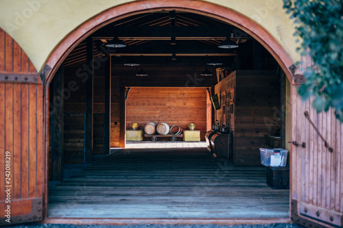 italian farm villa at day time with wine barrels