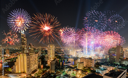 Celebration of New year day with colorful fireworks on Chao Phraya riverside with Iconsiam building landmark of Bangkok