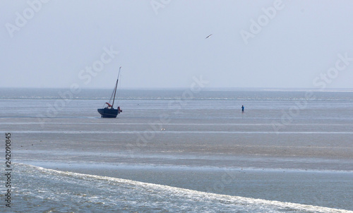 Beached sailing boat photo