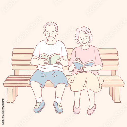 Middle aged couple reading books