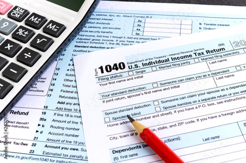 United States federal income tax return IRS 1040 documents and calculator