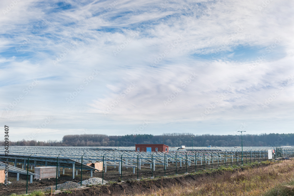 Construction of ground-mounted solar power station against sky Construction of ground-mounted solar power station against sky