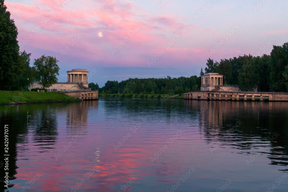 Obraz premium night landscape with the moon and the reflected sky in the river