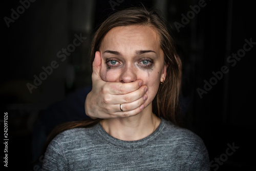 Portrait of a crying woman after beating by her husband. Female violence concept. Help for women suffering from domestic, woman violence. Social and life problems photo