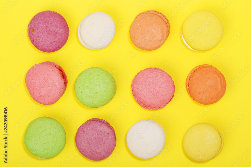 Bright background with rows of macaroons Bright background with rows of macaroons