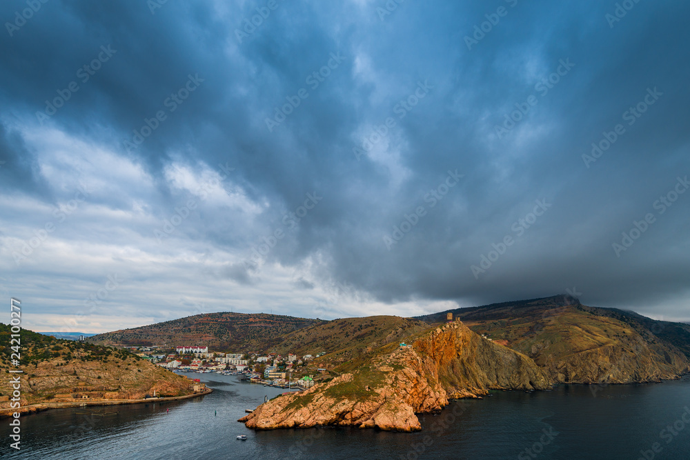 Heavy rain clouds over the bay, sea landscape