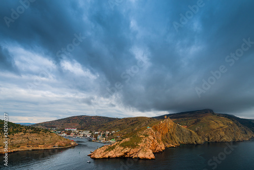 Heavy rain clouds over the bay, sea landscape