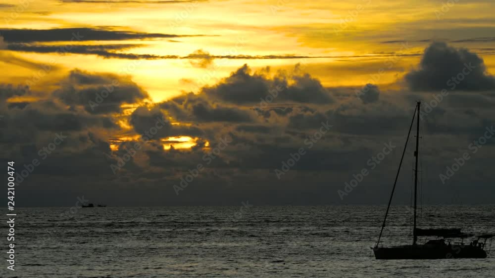 Yacht in the tropical sea at dramatic sunset Yacht in the tropical sea at dramatic sunset