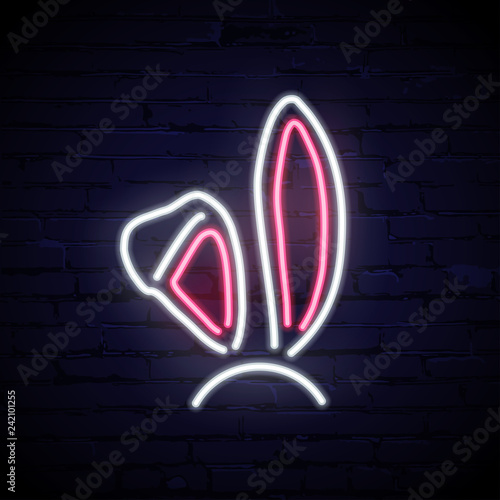 Pink and white neon rabbit ears isolated on dark brick background. Vector illustration.