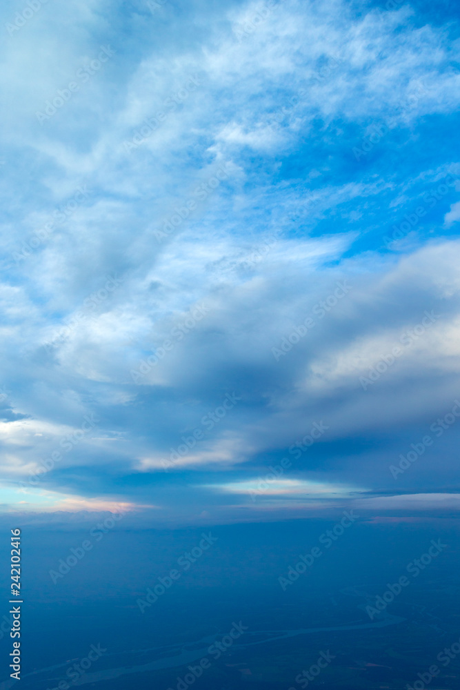 blue sky background with tiny clouds