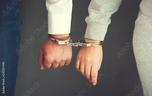 couple hand handcuffs