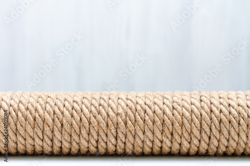 Sisal rope cat scratcher on white background. Copy space for text