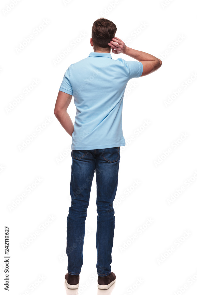 rear view of casual man wearing a blue polo shirt rear view of casual man wearing a blue polo shirt