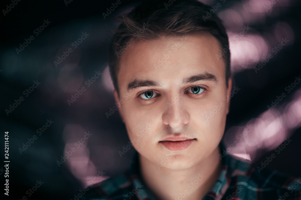 portrait of a young man on a blurred background portrait of a young man on a blurred background