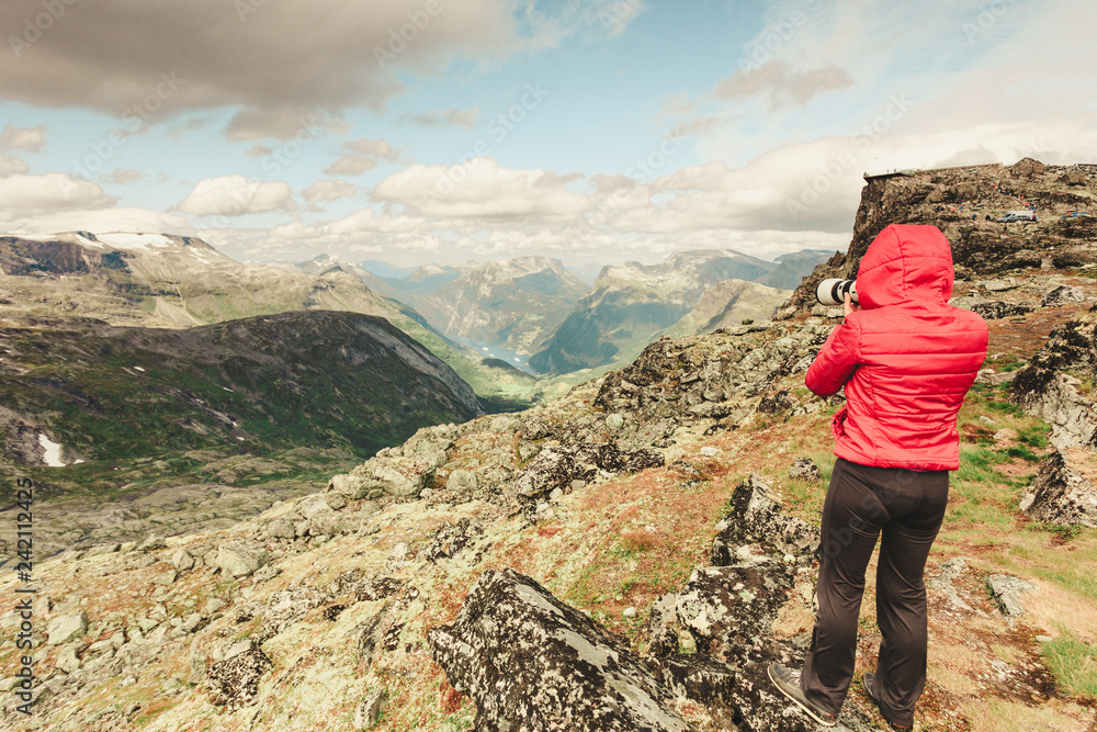 Tourist taking photo from Dalsnibba area Norway Tourist taking photo from Dalsnibba area Norway