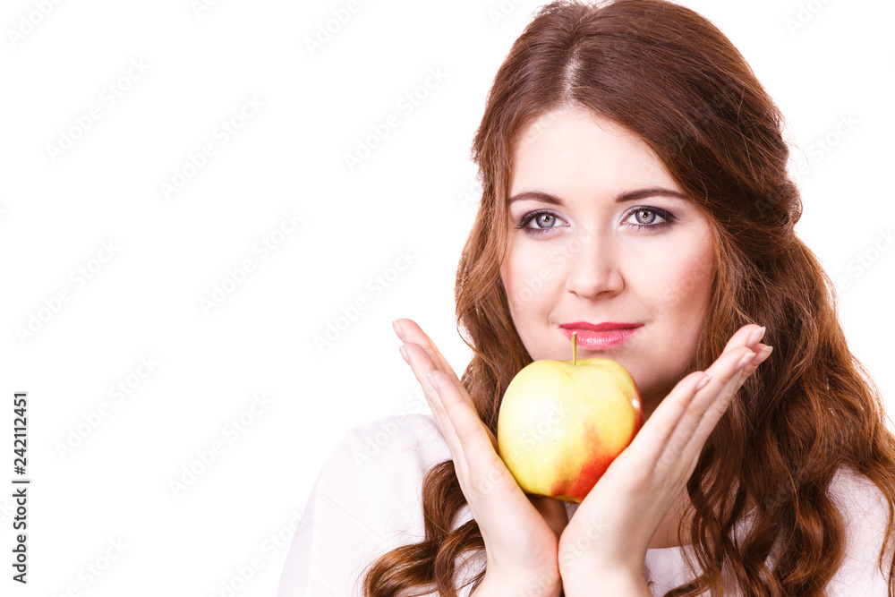 Woman holds apple fruit close to face, isolated Woman holds apple fruit close to face, isolated