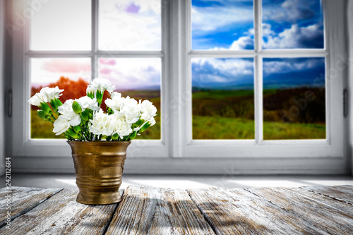 Table background of spring time and window space 