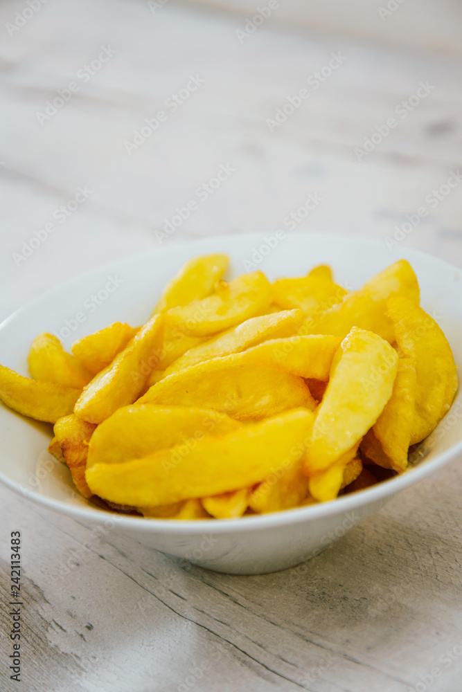 Golden French fries potatoes ready to be eaten Golden French fries potatoes ready to be eaten