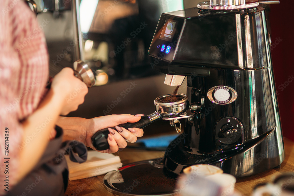 Barista using a coffee machine in cafe - obrazy, fototapety, plakaty 
