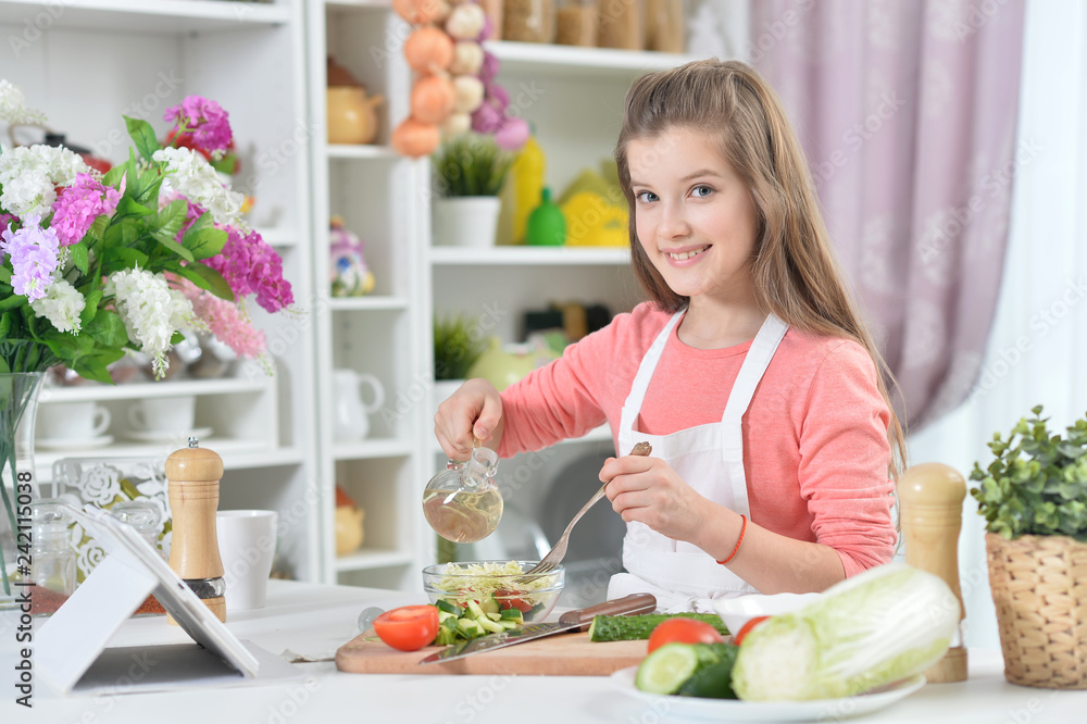 Portrait of young girl cooking in kitchen at home Stock Photo
