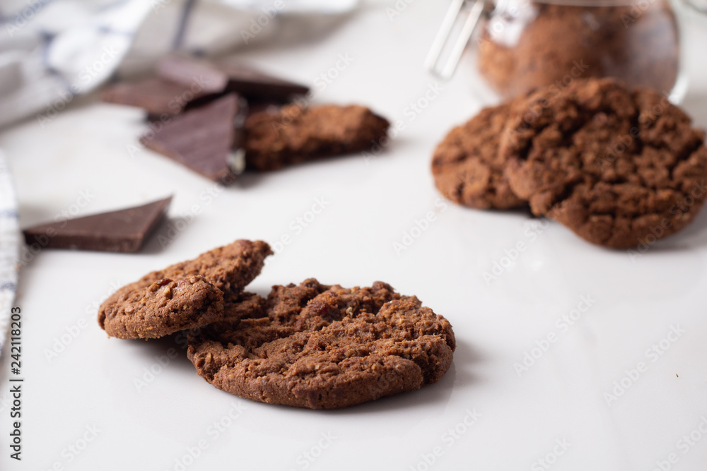 chocolate chip cookies. cocoa and dark chocolate on a white background close-up. chocolate chip cookies. cocoa and dark chocolate on a white background close-up.