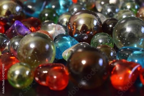 Multi-colored shiny glass balls close-up.