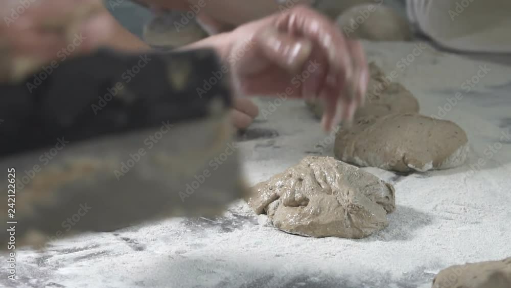 Baker kneads dough on bread. slow motion Baker kneads dough on bread. slow motion