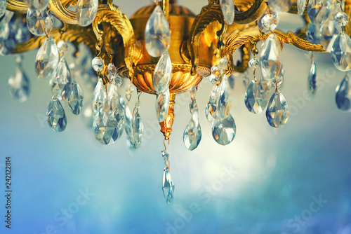 Crystal chandelier close-up. Gradient pastel background, sparkling background