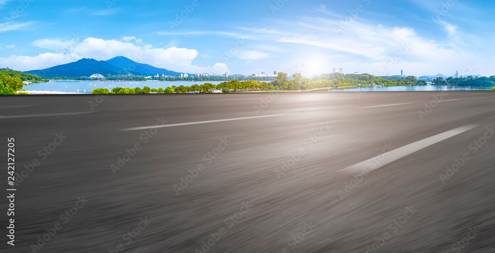 Fototapeta premium Empty asphalt road square and natural landscape under the blue sky