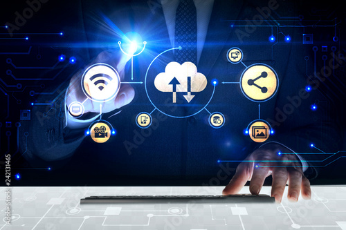 Businessman touching screen with about cloud system photo